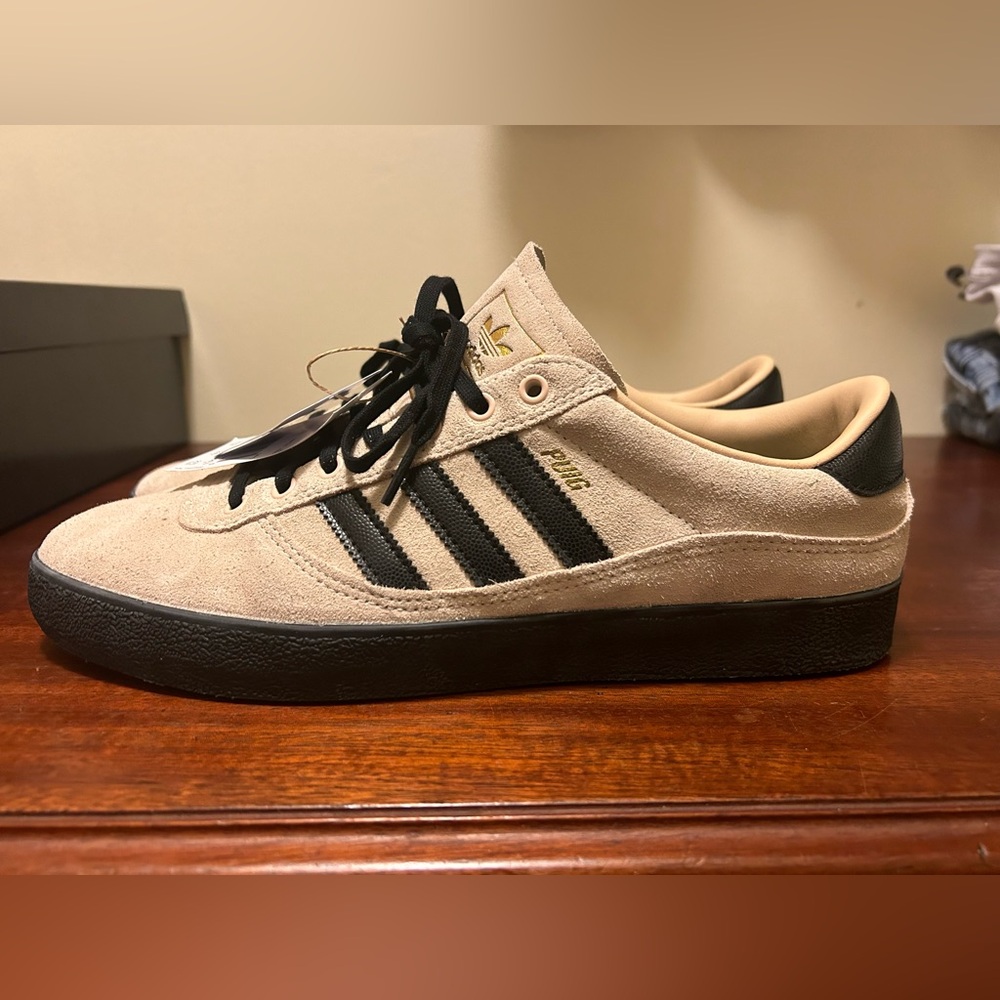NWT Adidas Puig men’s shoe. Size 10.5, never worn. Comes with box.